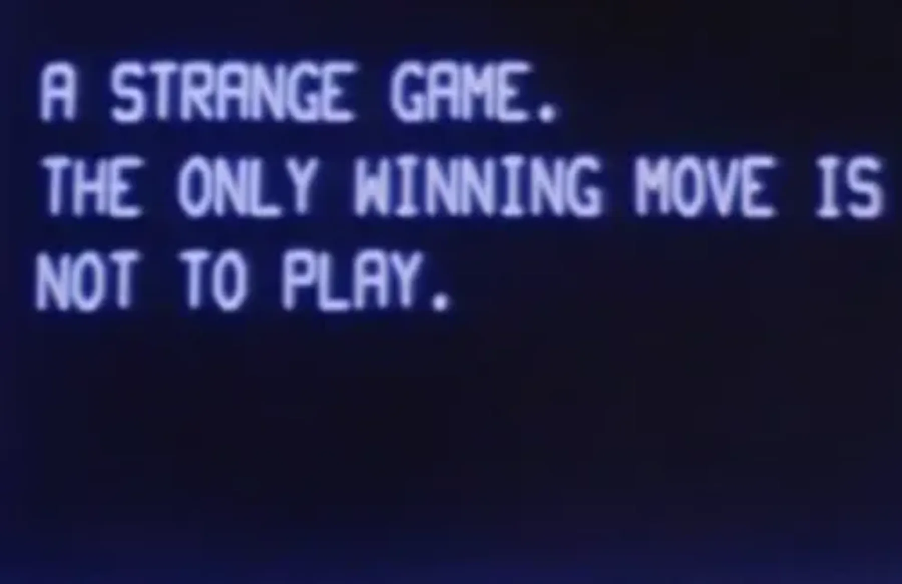Pixelated text on an old screen reading, "A STRANGE GAME. THE ONLY WINNING MOVE IS NOT TO PLAY.